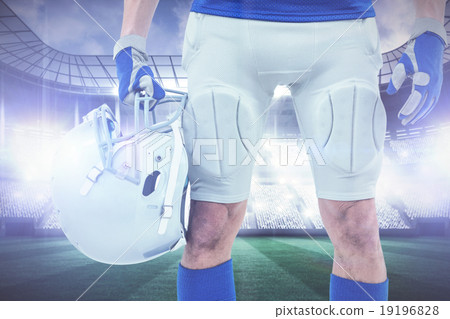 Composite image of midsection of american football player holdin 19196828