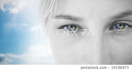 Composite image of pretty blonde applying contact lens 19196873