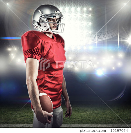 Composite image of serious american football player in red jerse 19197054