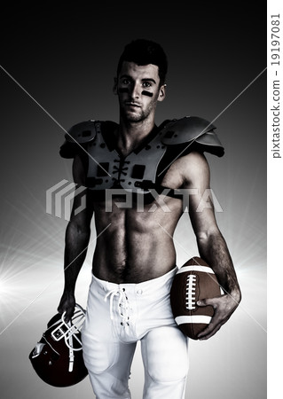 Composite image of portrait of rugby player holding ball and hel Composite image of portrait of rugby player holding ball and hel 19197081