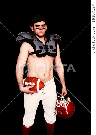 Composite image of american football player holding a ball and h Composite image of american football player holding a ball and h 19197157