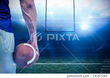 Composite image of close-up of american football player holding 19197264