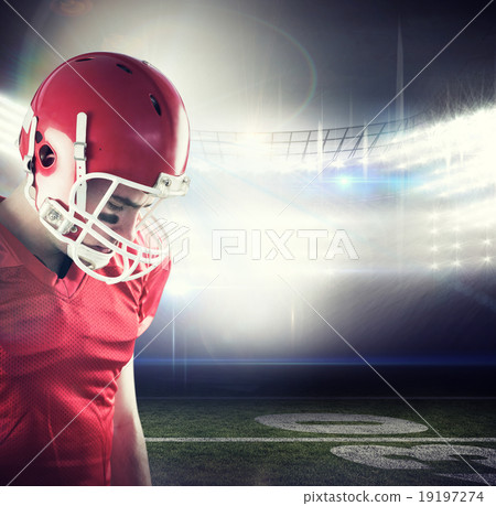 Composite image of amercian football player having his helmet on 19197274
