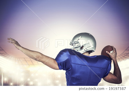 Composite image of rear view of american football player throwin 19197387
