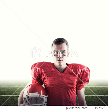 Composite image of a serious american football player looking at Composite image of a serious american football player looking at 19197423