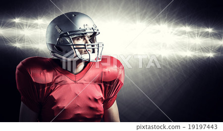 Composite image of american football player looking away while s 19197443