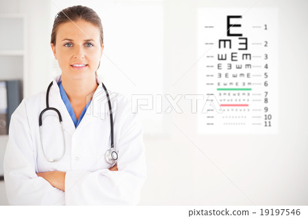 Composite image of charming doctor having a stethoscope around h Composite image of charming doctor having a stethoscope around h 19197546