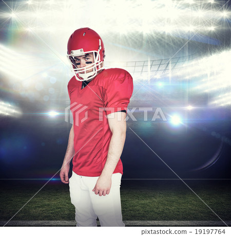Composite image of serious american football player looking at c 19197764