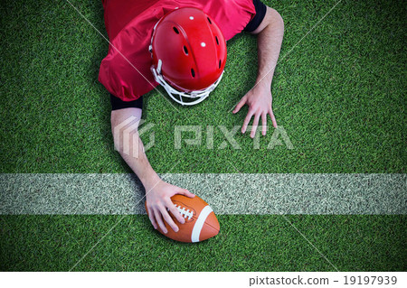 Composite image of american football player trying to score 19197939