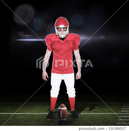 Composite image of serious american football player looking at c 19198037