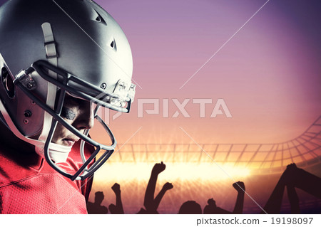 Composite image of american footballer looking down 19198097