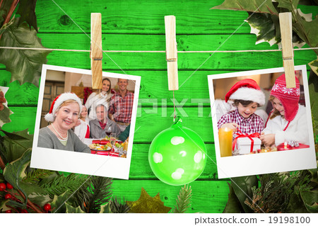 Composite image of hanging christmas photos Composite image of hanging christmas photos 19198100