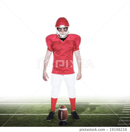 Composite image of serious american football player looking at c Composite image of serious american football player looking at c 19198238