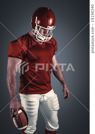 Composite image of american football player with ball Composite image of american football player with ball 19198340