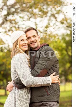 Portrait of smiling young couple embracing Portrait of smiling young couple embracing 19198640