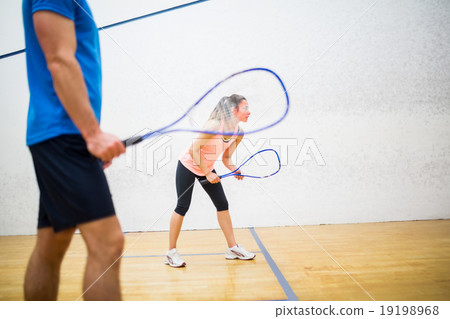 Woman about to serve the ball Woman about to serve the ball 19198968