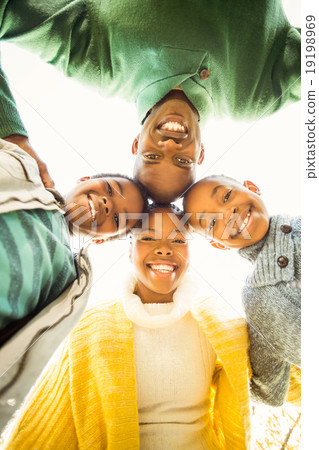 Young family doing a head circles Young family doing a head circles 19198969