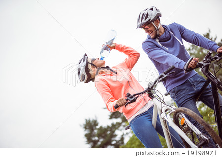 Happy couple on a bike ride Happy couple on a bike ride 19198971