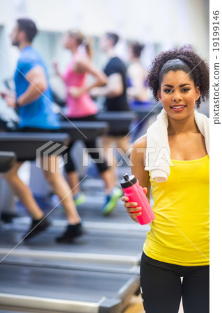 Fit woman smiling at camera 19199146