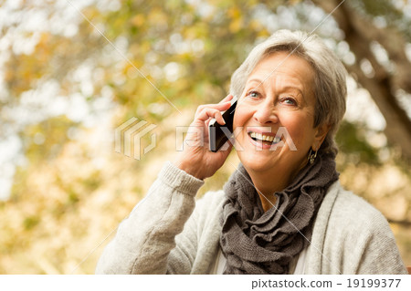 Senior woman in the park Senior woman in the park 19199377