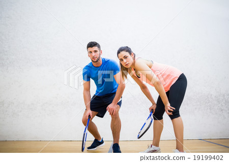 Couple tired after a squash game 19199402