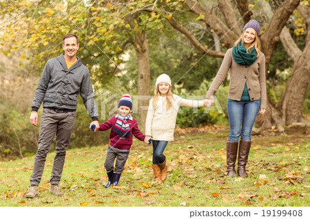 Smiling young family posing together 19199408