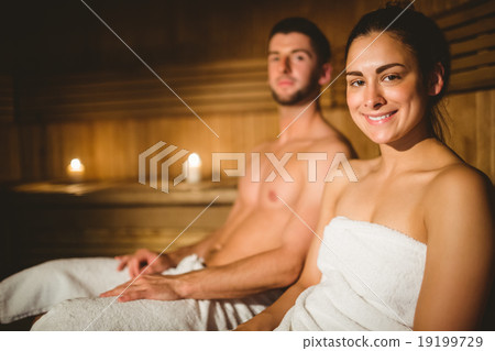 Happy couple enjoying the sauna together 19199729