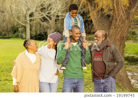 Extended family posing with warm clothes 19199745