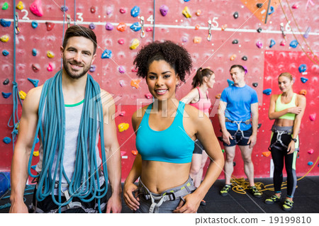 Fit people getting ready to rock climb Fit people getting ready to rock climb 19199810