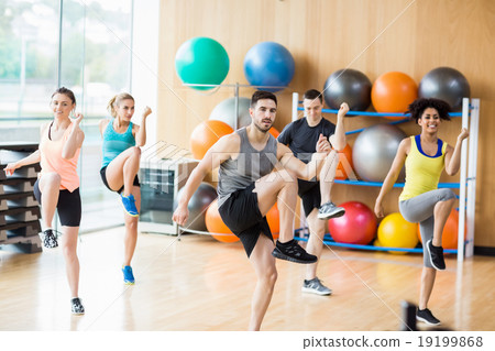 Fitness class exercising in the studio Fitness class exercising in the studio 19199868