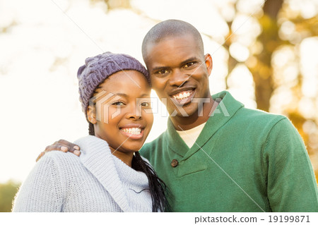 Portrait of a lovely smiling young couple 19199871