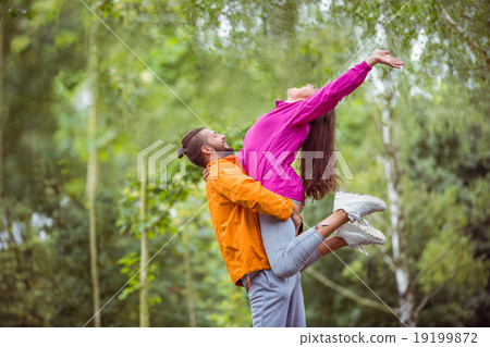 Happy couple hugging on hike Happy couple hugging on hike 19199872
