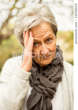 Senior woman in the park Senior woman in the park 19200039