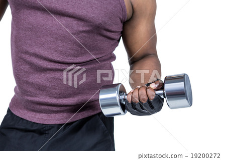 Fit man exercising with dumbbell Fit man exercising with dumbbell 19200272
