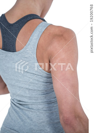 Rear view of muscular woman looking down 19200768