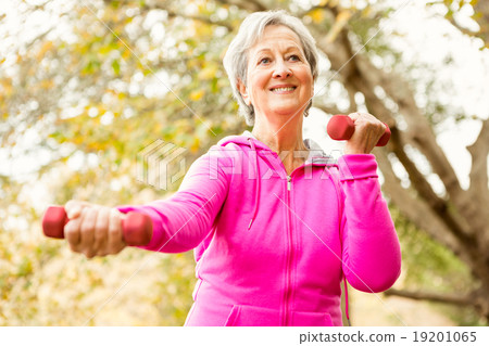 Senior woman in the park 19201065