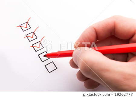 Hand with pen and check boxes Hand with pen and check boxes 19202777
