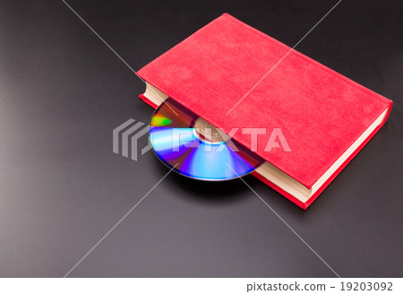Cd is sticks out from red book Cd is sticks out from red book 19203092