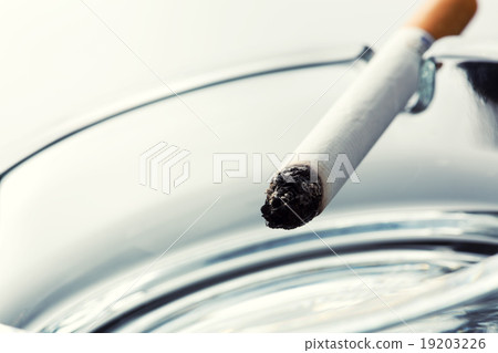 Cigarette on ashtray 19203226