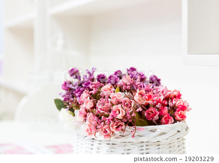 Beautiful bouquet of bright flowers in basket 19203229