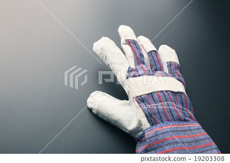 Work glove against grey Work glove against grey 19203308