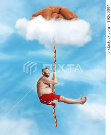 Man hanging on the sausage rope 19206094