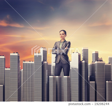 Woman standing among skyscrapers 19206244