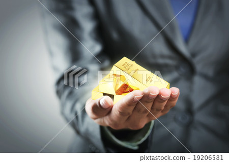 Golden bars on the woman's hand Golden bars on the woman's hand 19206581