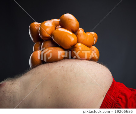 Heap of sausages on the belly Heap of sausages on the belly 19206686