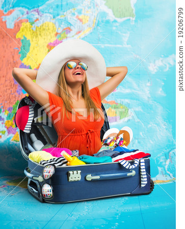 Young woman in suitcase on map Young woman in suitcase on map 19206799