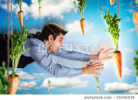 Businessman flying with carrots 19206836