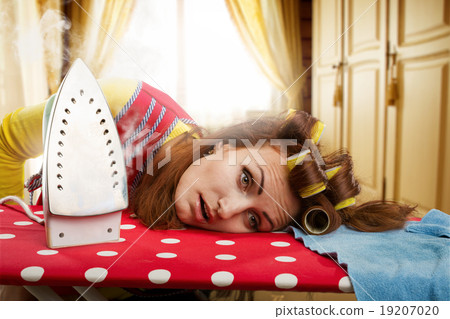 Tired housewife with ironing-board Tired housewife with ironing-board 19207020