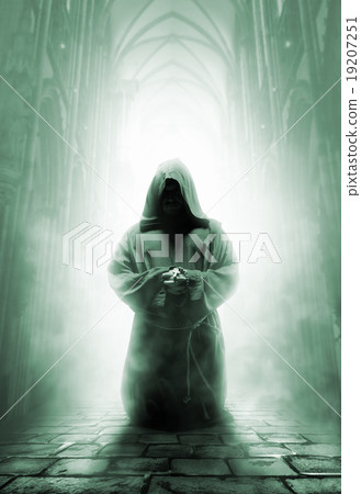 Praying medieval monk in dark temple corridor 19207251