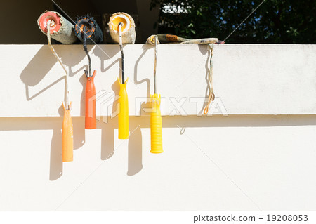 Color roller paint on the white wall background Color roller paint on the white wall background 19208053